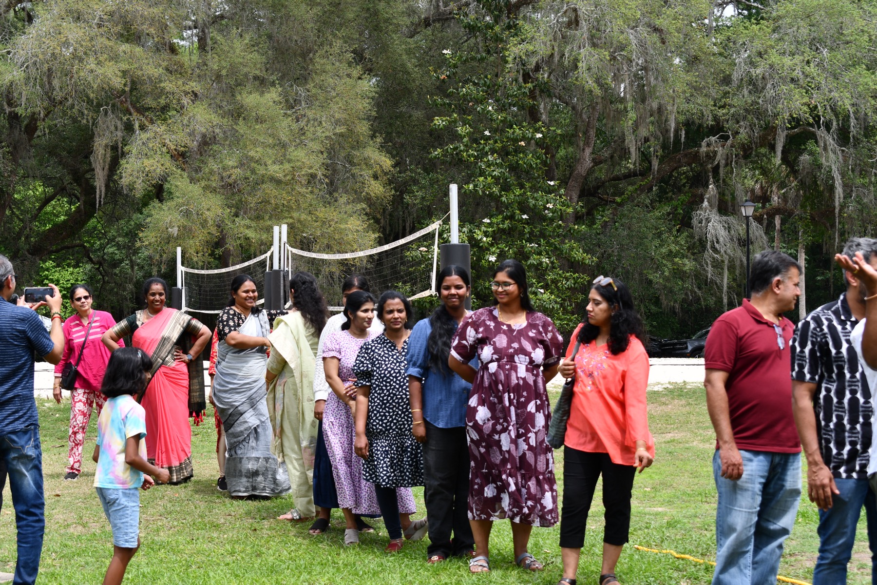 Members of Tallahassee Tamil Mandram gathered on the lawn at a community event