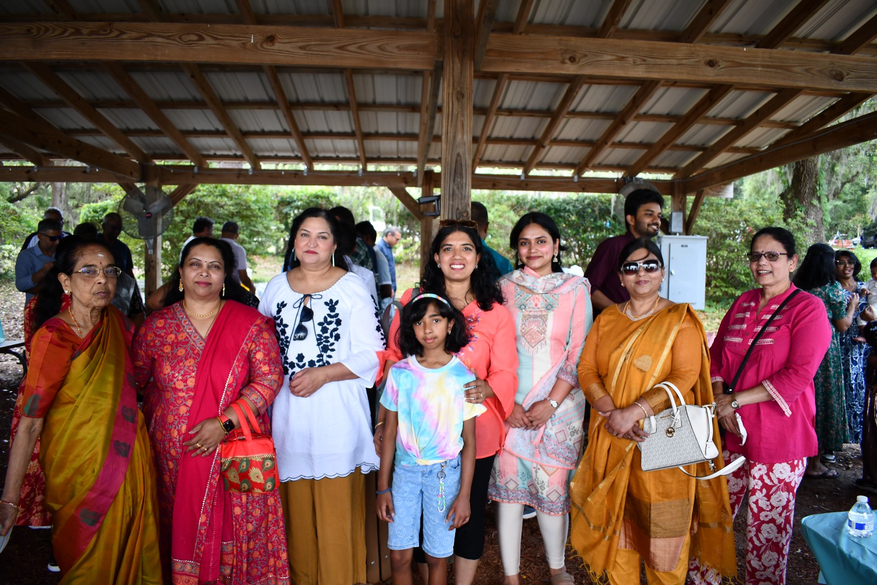 Women and children of the Mandram in colourful traditional dress at a gathering
