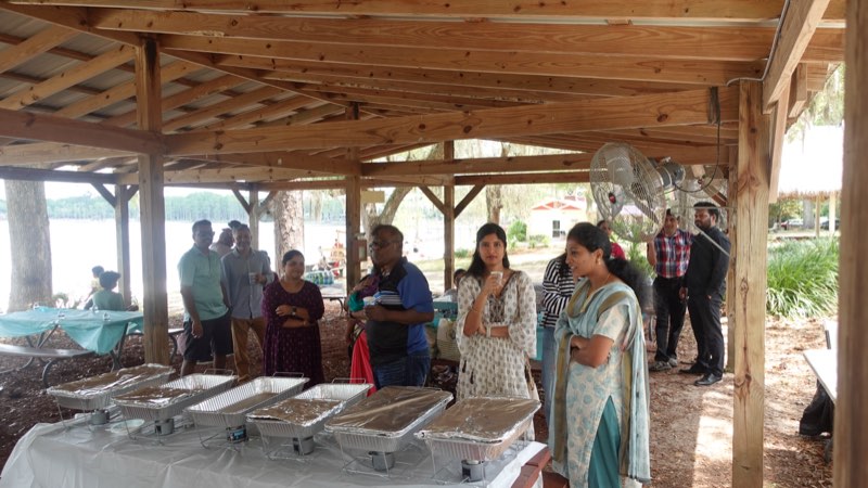The community potluck laid out under the pavilion at Chithirai Thiruvizha